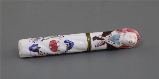 A needle case, decorated in St. Cloud style, with a love motif and motto, the cover modelled with a womans head, L. 13cm